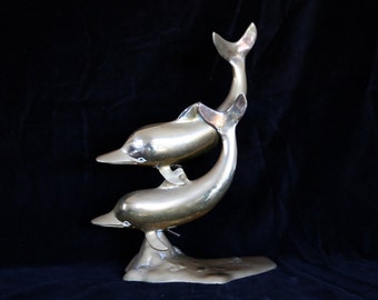 Ornamental brass dolphins sculpture