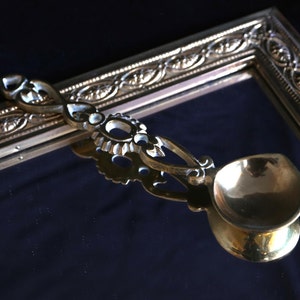 Vintage brass decorative serving spoon. image 1