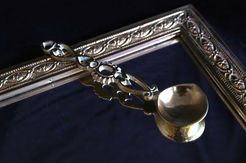 Vintage brass decorative serving spoon. image 1