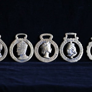 Vintage cast brass commemorative royal themed saddle brass medallions