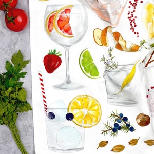 May include: A white kitchen towel with a colorful illustration of various ingredients for a gin and tonic cocktail. The illustration includes a gin glass with a grapefruit slice, a lime wedge, a sprig of rosemary, a lemon wedge, juniper berries, and a sprig of thyme.