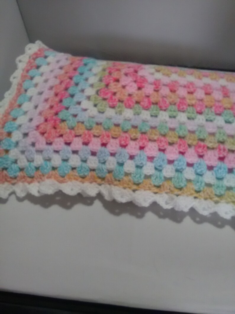 Hand crochet Baby pram blanket made in uk two sizes hats unisex colours White shell edge with two hats babies shawl variagated yarn