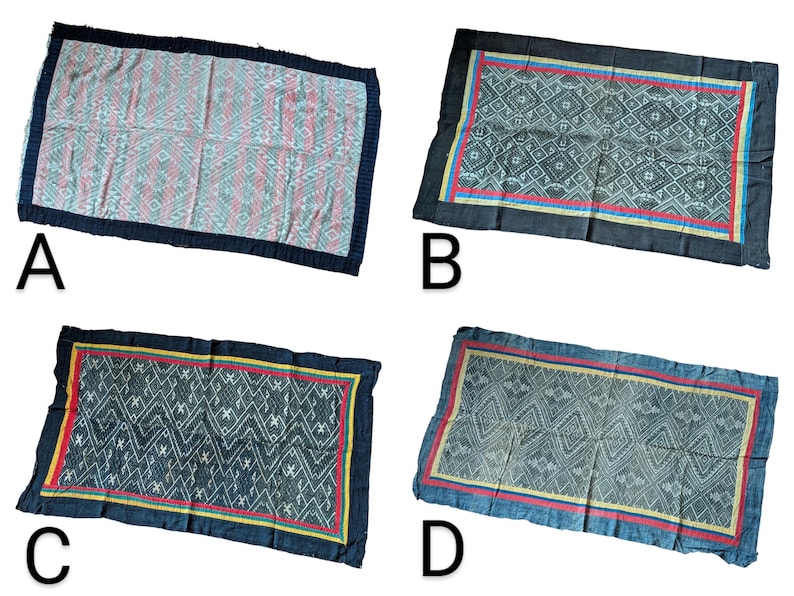 May include: Four rectangular textiles with geometric patterns and dark blue borders. The textiles feature various colour schemes, including pink, red, and yellow accents. The designs are intricate and detailed, showcasing a variety of shapes and lines.
