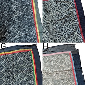 May include: Four textiles with geometric patterns. Each textile has a dark background with white or light-coloured designs. The borders feature contrasting colours like red, yellow, and green. The textiles appear to be handmade.