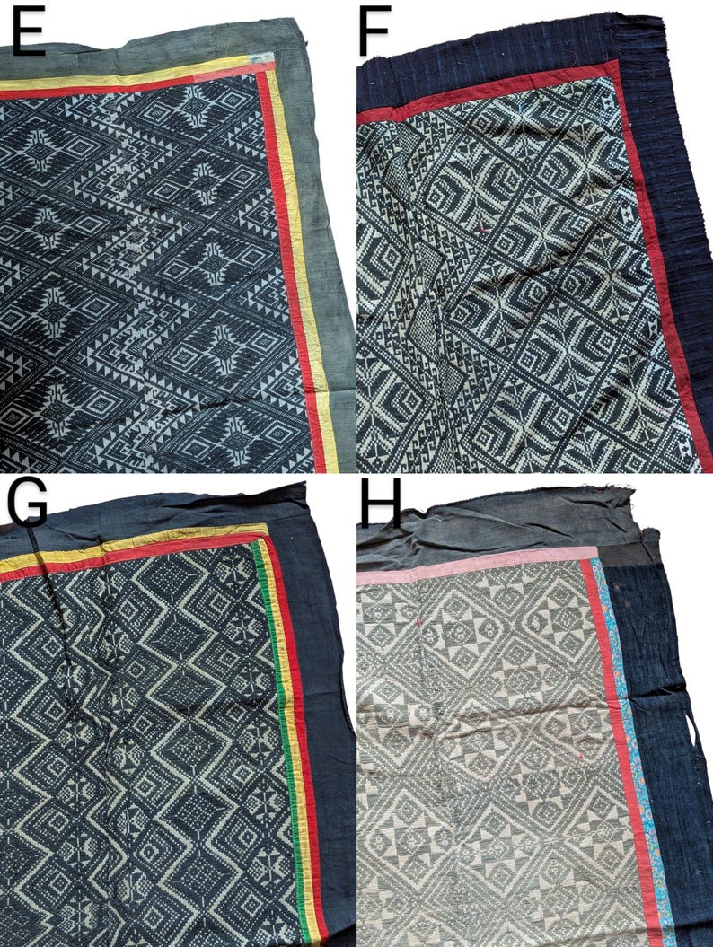 May include: Four textiles with geometric patterns. Each textile has a dark background with white or light-coloured designs. The borders feature contrasting colours like red, yellow, and green. The textiles appear to be handmade.