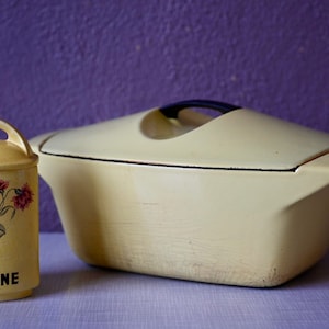 Yellow cast iron casserole dish by Raymond Loewy for Le Creuset Casserole design