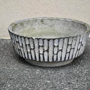 Vintage outdoor concrete basin or planter. Vintage brutalist garden design wabi sabi spirit flower pot