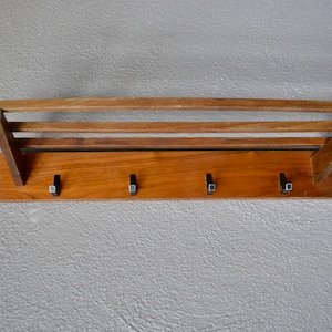 Wall-mounted wooden and metal coat racks with a vintage Scandinavian design