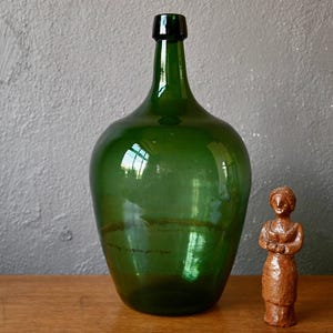 Dame Jeanne carboy bottle with elongated neck in green glass century old decoration vase vintage rustic boho style French industrial
