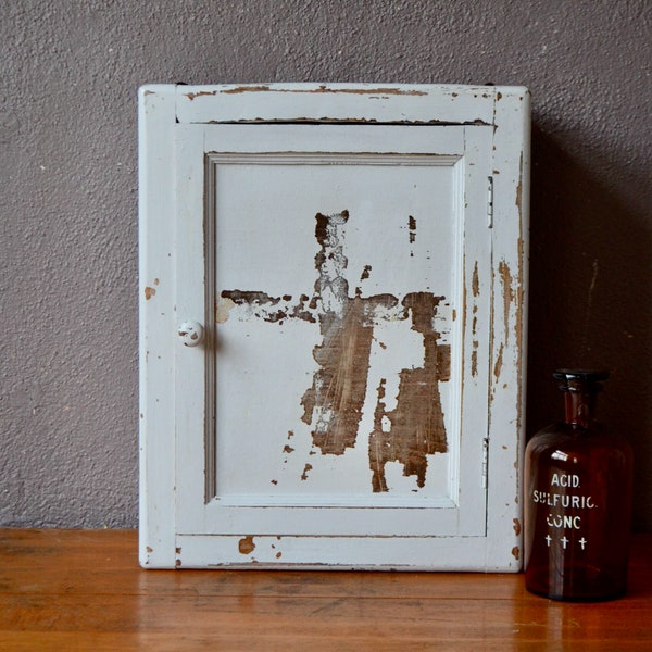 Vintage patinated pharmacy bathroom cabinet in shabby chic and boho style