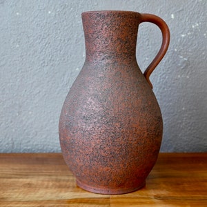 Jug pitcher or water pitcher in terracotta vintage brutalist boho style and chic countryside