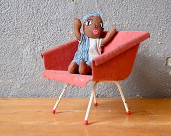 Miniature armchair in midcentury design in toy metal or Scandinavian vintage style decor