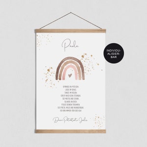 May include: A watercolor rainbow with a heart in the center, surrounded by gold glitter. The text "Paula" is at the top of the image. Below the rainbow is a poem in German that reads: "Springe in Pf&uuml;tzen. Liege im Gras. Tanze im Regen. Greif nach den Sternen. Sei mutig und stark. Glaube an dich. Folge deinen Tr&auml;umen. Sei frech, wild und wunderbar. Ich bin immer f&uuml;r dich da." The text "Deine Patentante Jolie" is at the bottom of the image.