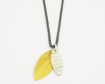 Pilar by Fedha - double leaf pendant in silver and vermeil on oxidised spiga chain, textured, corrugated