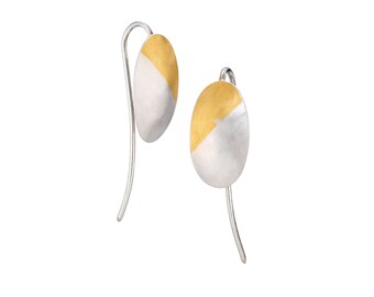 Felicia by Fedha - silver and gold domed oval earrings on statement curved wire