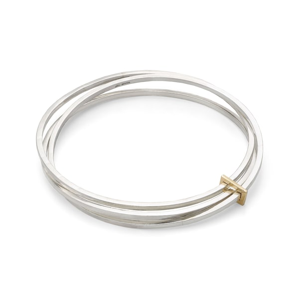 Clara by Fedha - stylish set of three polished sterling silver bangles with solid gold link, uncluttered, understated