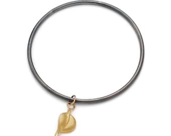 Luz by Fedha - oxidised sterling silver bangle with leaf pendant in vermeil, solid silver casting, 24ct gold
