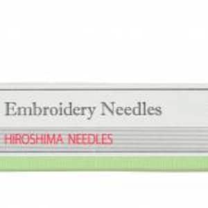 May include: A green and white package of embroidery needles labeled "Embroidery Needles" and "Hiroshima Needles". The package has a red string attached to it and a red and white label with the number "8" and the text "Sharp Tip" on it.