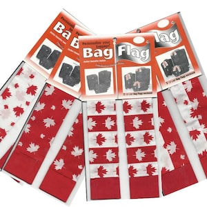 May include: Five red and white Canadian flag luggage tags with a maple leaf design. The tags are packaged with a header that reads "Personalize your luggage! Bag Flag 2 x 12" Bag Flags enclosed"