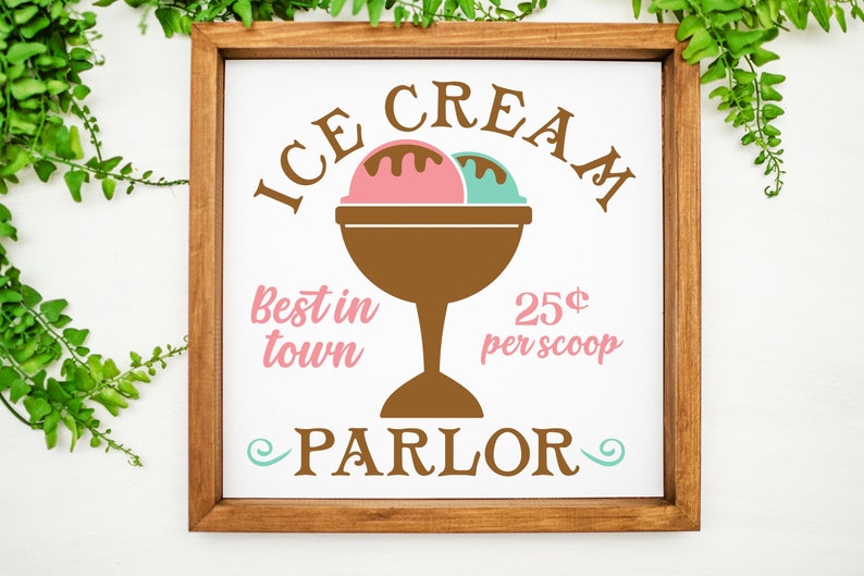 May include: A white sign with brown text that reads "ICE CREAM" in a curved arch above a brown ice cream dish with two scoops of ice cream, one pink and one green. The text "Best in town" is in pink below the ice cream dish and "25&cent; per scoop" is in pink to the right of the dish. The text "PARLOR" is in brown below the ice cream dish with a swirl design on either side.