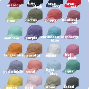 May include: A collection of baseball caps in various colors, including maroon, black, navy, and red. Other colors include lime, cactus, poppy, and nautical red. Additional colors are seafoam, purple, and Caribbean blue. The caps are arranged on a light blue background.