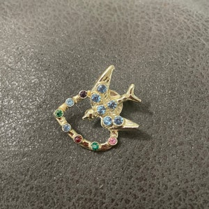 Silver tone bird multicolor faux stones brooch/pin