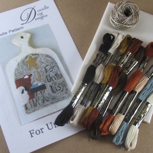 May include: A punch needle pattern kit with a Christmas theme. The kit includes a pattern with the text "For Unto Us", embroidery floss in various colors, a piece of fabric, and a ball of twine. The pattern features a nativity scene.