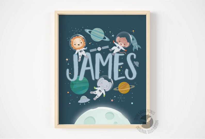 May include: A blue and white space-themed printable art print with the name "JAMES" in large, blue letters. The print features a lion, monkey, and elephant wearing astronaut suits and floating in space with planets and stars.
