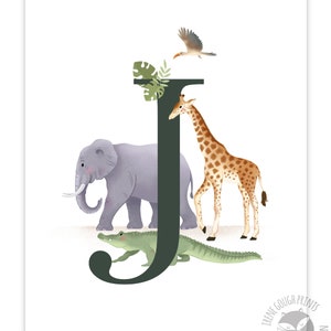 May include: A green letter J with a purple elephant, a brown giraffe, a green alligator, and a brown bird with a yellow beak. The letter J is surrounded by green leaves.