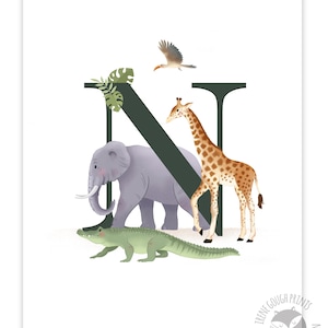 May include: A green letter N with a giraffe, elephant, and alligator in front of it. The animals are all facing the right side of the image. There are green leaves in the top left corner of the image. The letter N is in a dark green color.