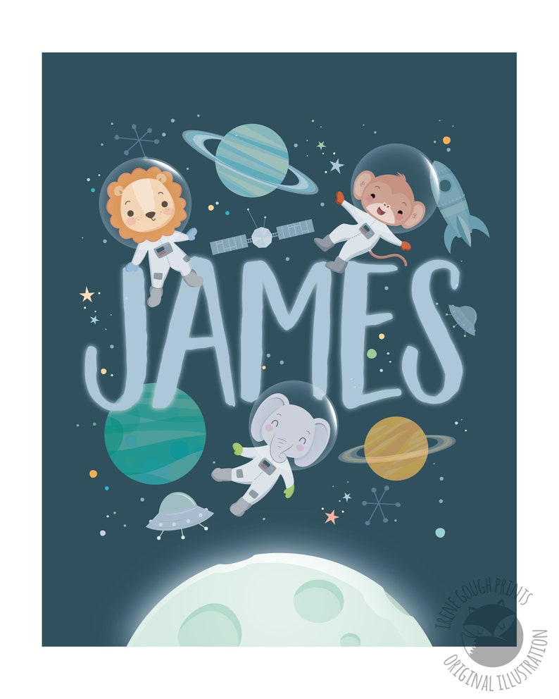 May include: A blue and white space-themed nursery print with the name "JAMES" in large white letters. Three animal astronauts, a lion, a monkey, and an elephant, are floating in space with planets and stars.