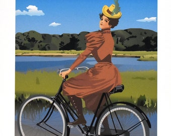 May include: A woman in a brown dress and a yellow hat rides a black bicycle on a path by a body of water. The scene is set against a blue sky with white clouds and green trees in the background.