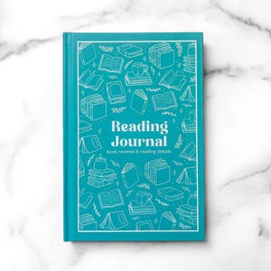 May include: A teal hardcover reading journal with white line art illustrations of books, mugs, and plants. The front cover features the centered white text Reading Journal book reviews & reading details surrounded by a rectangular white border frame.