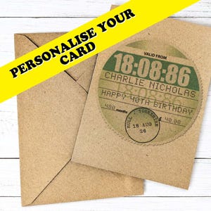 May include: A brown kraft paper greeting card and matching envelope. The card features a circular design resembling a vintage train ticket with the text 18:08:86, CHARLIE NICHOLAS, HAPPY 40TH BIRTHDAY, 480 months, and a circular stamp reading HULL YORKSHIRE.