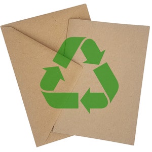 May include: Two brown paper envelopes with a green recycle symbol printed on the front.