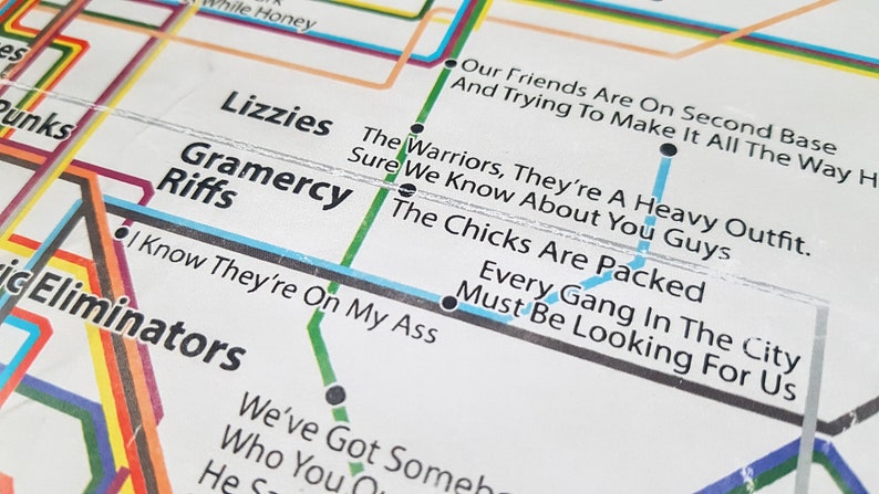 May include: A white subway map with black lines and text. The text includes the names of bands and song titles. The text reads "Our Friends Are On Second Base And Trying To Make It All The Way Home", "The Warriors, They're A Heavy Outfit. Sure We Know About You Guys", "The Chicks Are Packed", "Every Gang In The City Must Be Looking For Us", "Gramercy Riffs", "I Know They're On My Ass", "Lizzies", and "Punks".