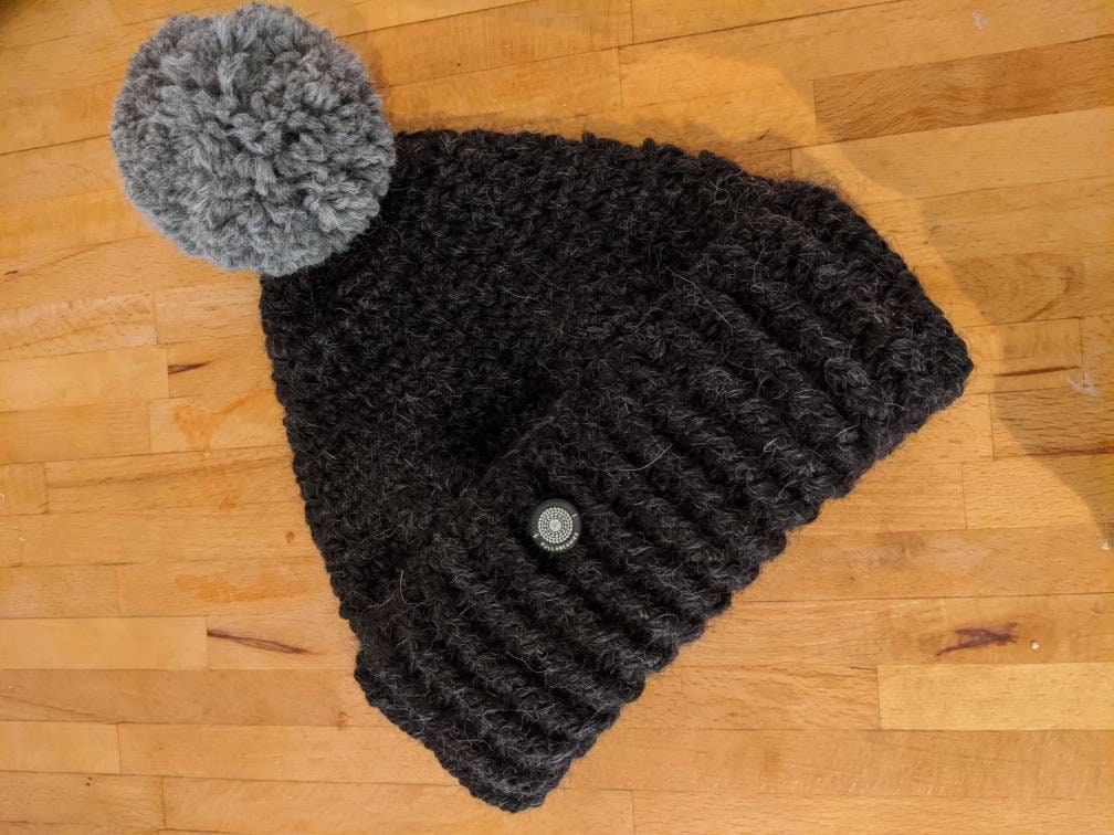 100% Alpaca Hand Made Pompom Beanie in Black, Brown, Light Brown and Grey.