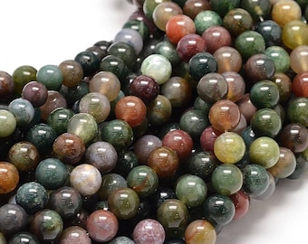May include: A strand of round, multi-colored agate beads. The beads are a mix of green, brown, red, and white. The beads are all about 8mm in diameter.