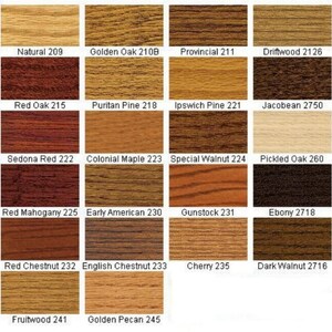 May include: A grid of twenty-one wood stain color samples, each labeled with a name and number, including Natural 209, Golden Oak 210B, Provincial 211, Driftwood 2126, Red Oak 215, Puritan Pine 218, Ipswich Pine 221, Jacobean 2750, Sedona Red 222, Colonial Maple 223, Special Walnut 224, Pickled Oak 260, Red Mahogany 225, Early American 230, Gunstock 231, Ebony 2718, Red Chestnut 232, English Chestnut 233, Cherry 235, Dark Walnut 2716, Fruitwood 241, and Golden Pecan 245.