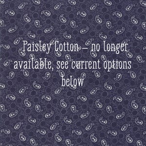 May include: Dark blue paisley cotton fabric with white paisley designs and the text "Paisley Cotton - no longer available, see current options below."