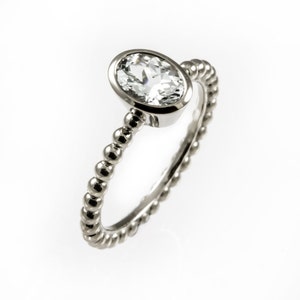 White sapphire engagement ring, thin and delicate wedding ring, bezel engagement ring, beaded engagement ring,oval stone,unique ring for her