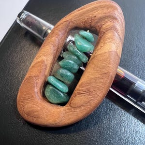 May include: A handmade wooden sign with the text "Welcome" in a playful font. The sign is painted white with a distressed finish, and features a decorative floral design in shades of pink and green. Includes a jute rope for hanging.