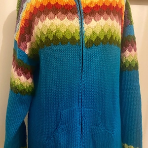 Hooded cardigan, Peruvian, plated pockets, knitted in multicolored wool and turquoise blue, L, 42