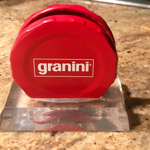 Granini, Porte serviettes papier, support  serviettes publicitaire, à déposer sur la table, motifs capsules, métal rouge,