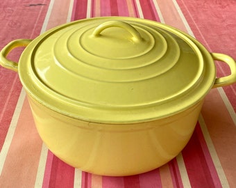 Round enameled cast iron cocotte with handles, yellow, French vintage