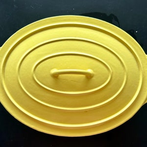 Yellow enameled cast iron casserole dish, oval, with handles, vintage French, 1960s