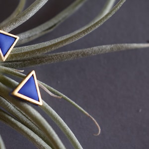 Golden triangle shaped polymer clay earrings. image 1