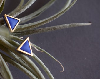 Golden triangle shaped polymer clay earrings.