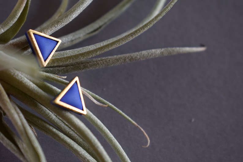 Golden triangle shaped polymer clay earrings. image 1