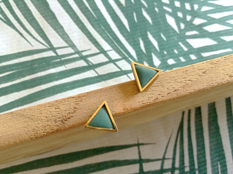 Golden triangle shaped polymer clay earrings. image 2